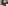 Frau schiebt Indoorrollator Pixel von Rehasense mit einer Tasse darauf durch einen Raum